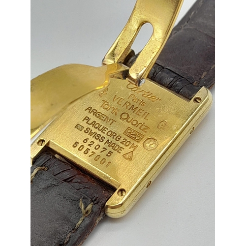 474 - An 18K Gold Must de Cartier Ladies Tank Watch. Brown leather strap and gold buckle. 18k gold case - ... 