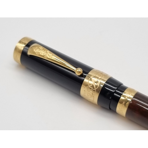 89 - A Mont Blanc Limited Edition Francois Fountain Pen. Black resin and gold plate cap. Brown resin and ... 