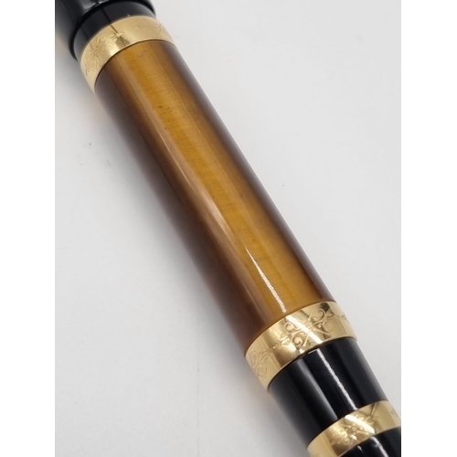 89 - A Mont Blanc Limited Edition Francois Fountain Pen. Black resin and gold plate cap. Brown resin and ... 