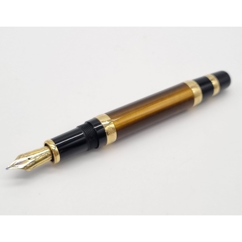 89 - A Mont Blanc Limited Edition Francois Fountain Pen. Black resin and gold plate cap. Brown resin and ... 