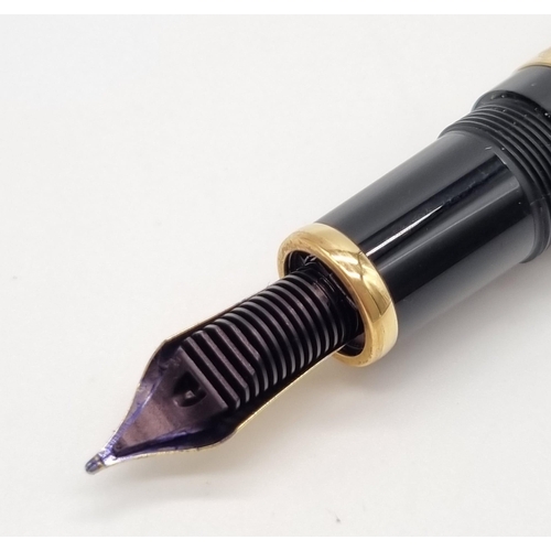 89 - A Mont Blanc Limited Edition Francois Fountain Pen. Black resin and gold plate cap. Brown resin and ... 