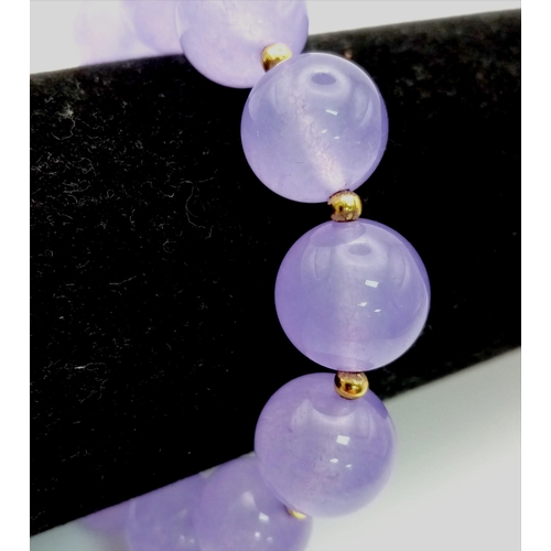 1176 - A Lavender Jade Beaded Expandable Bracelet. Gilded spacers.