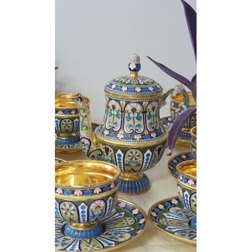 52 - A RUSSIAN SILVER GILT AND CLOISONNÉ ENAMEL TEA SET.

Complete set of 13 pieces .
Superb condition 
E... 