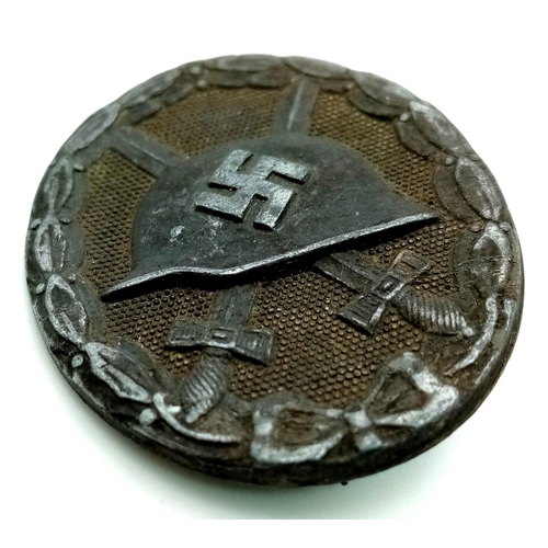 271 - A WW2 German Nazi 3rd Class Wound Iron Badge - 1 to 2 wounds. 4.5cm.