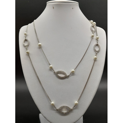 356 - An Opera Length Givenchy Faux Pearl and Diamond Dress Necklace. 94cm. Ref - 9620.