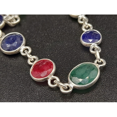 542 - A 22 gram Ruby, Emerald and Sapphire Long Chain Necklace set in 925 Silver. 68cm.