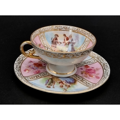 46 - An Antique Meissen Miniature Cup and Saucer. Soft pastel colours. Pastoral scenes and gilded decorat... 