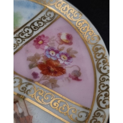 46 - An Antique Meissen Miniature Cup and Saucer. Soft pastel colours. Pastoral scenes and gilded decorat... 