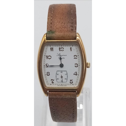 533 - A Vintage Longines Gents Quartz Watch. Leather strap. Case - 35 x 27mm. White dial with sub second d... 