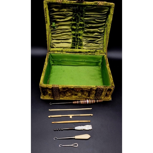 534 - A Wonderful Victorian Green Velvet Beauty Box. Comes with a selection of antique corset adjusters an... 