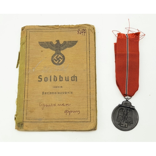 299 - WW2 German Sold Buch (Pay Book) for a P.O.W. in Russia with Eastern Front Medal Included.