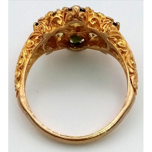 150 - A 9K Yellow Gold High-Georgian-Styled Peridot and Tourmaline Ring. Shades of green for this regal-es... 