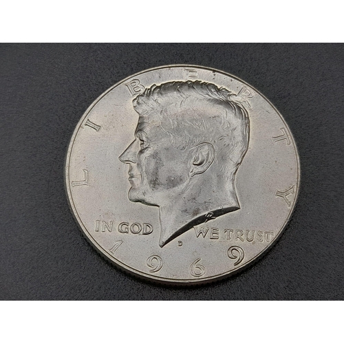 310 - Four American Silver Coins: Two one dollars and two half dollars. Please see photos for conditions.