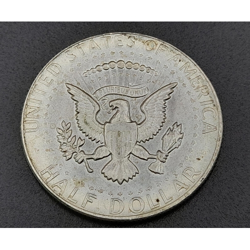 310 - Four American Silver Coins: Two one dollars and two half dollars. Please see photos for conditions.