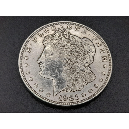 310 - Four American Silver Coins: Two one dollars and two half dollars. Please see photos for conditions.