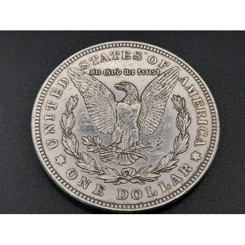 310 - Four American Silver Coins: Two one dollars and two half dollars. Please see photos for conditions.