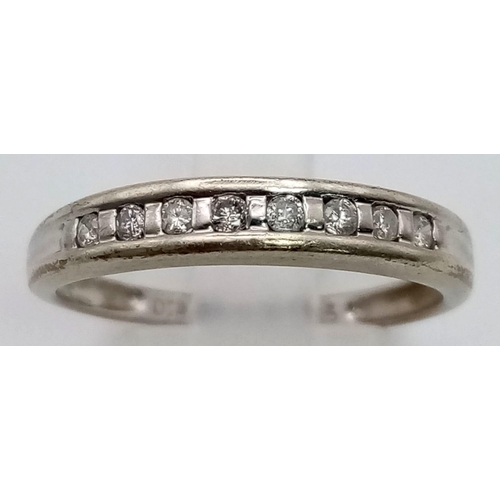 508 - A 9K White Gold Diamond Half-Eternity Ring. Size Q. 2.26g total weight.