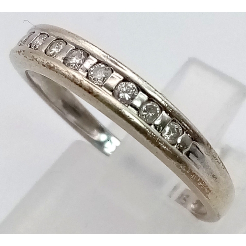 508 - A 9K White Gold Diamond Half-Eternity Ring. Size Q. 2.26g total weight.