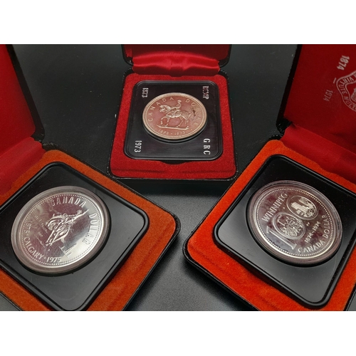 521 - Three Uncirculated Canadian Silver Dollars in Original Presentation Cases.