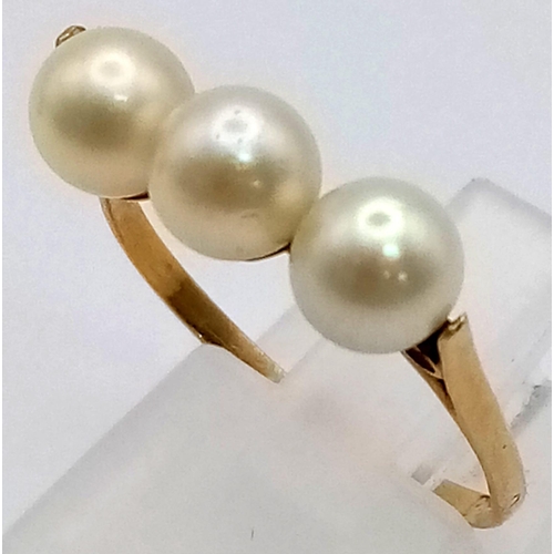 522 - A High K Gold (tested) Three Pearl Ring.
Size P. 2g total weight.