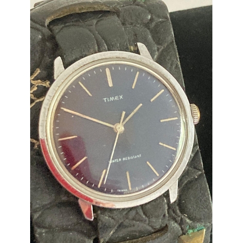 154 - Gentlemans vintage TIMEX 1960’s wristwatch having black face with sweeping second hand. Manual windi... 