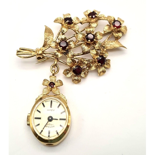 164 - A Rare 1940s 9K Gold Rotary Watch Brooch Pin. A gold bunch of rustic flowers with garnets as decorat... 