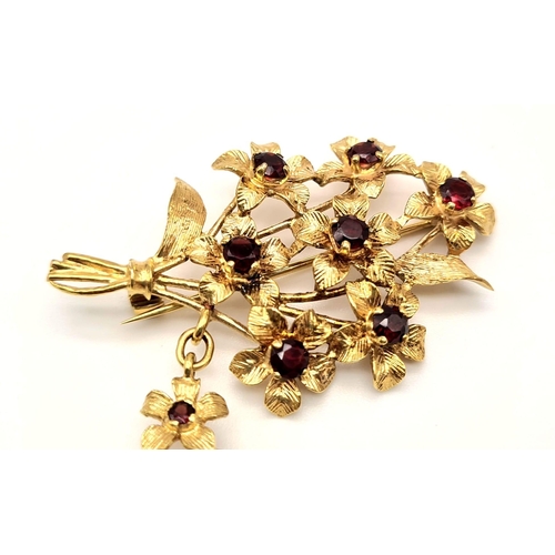 164 - A Rare 1940s 9K Gold Rotary Watch Brooch Pin. A gold bunch of rustic flowers with garnets as decorat... 