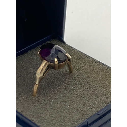 217 - 9 carat GOLD RING with large amethyst colour SOLITAIRE  set to top in four claw cradle mount. Comple... 