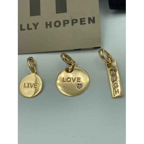 231 - 3 x  KELLY HOPPEN SILVER CHARMS complete with original pouch and case. Gilded to appear as gold. Con... 