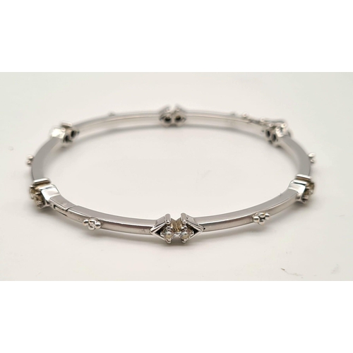 51 - 18K WHITE GOLD DIAMOND SET BANGLE 0.60CT 16.9G