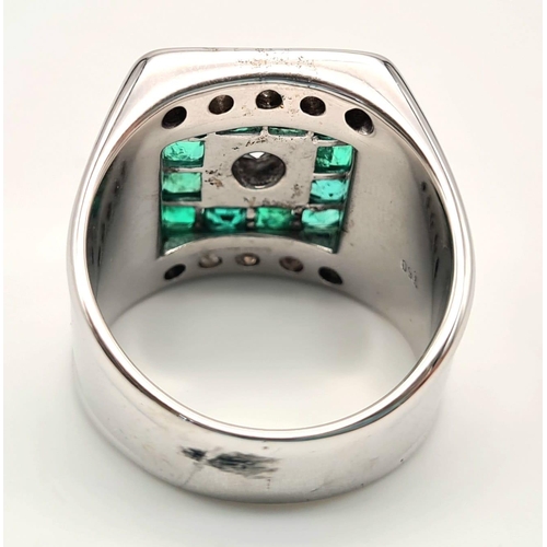 71 - A Heavy 18k White Gold Emerald and Diamond Dress Ring. Central round-cut brilliant diamonds surround... 