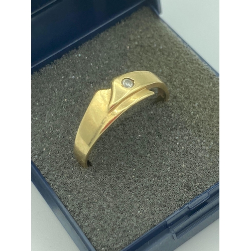 98 - 14 carat yellow GOLD RING in modernist Danish crossover style. Approx 3.0 grams. Size V.