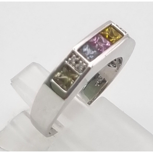 319 - An 18K White Gold Multi-Coloured Sapphire Ring. Blue, yellow, pink and green square-cut sapphires se... 