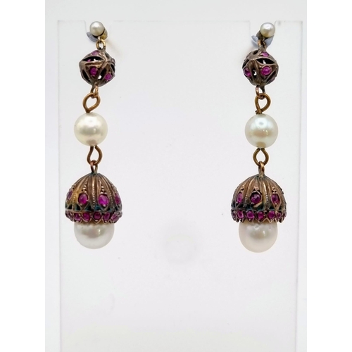 326 - An Antique (Mid 19th Century) Pair of Ruby and Pearl Lampshade drop earrings. Over 1ct of quality, c... 