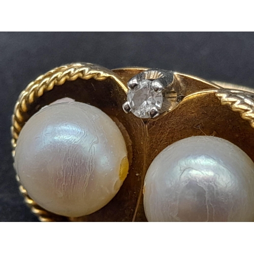 45 - An 18K Yellow Gold Pearl and Diamond Ring. Two round brilliant cut natural diamonds and two near-rou... 