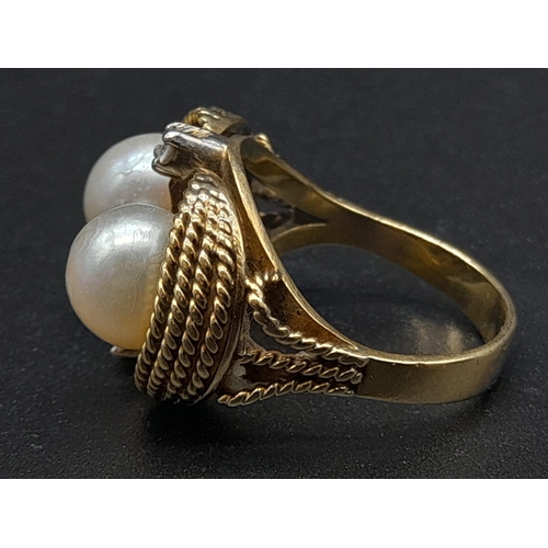 45 - An 18K Yellow Gold Pearl and Diamond Ring. Two round brilliant cut natural diamonds and two near-rou... 