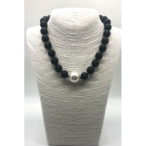 179 - A Black Jasper and High Lustre White Shell Pearl Necklace. Jasper - 14mm. Shell- 20mm. 18k Gold-plat... 