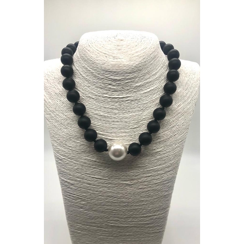 179 - A Black Jasper and High Lustre White Shell Pearl Necklace. Jasper - 14mm. Shell- 20mm. 18k Gold-plat... 