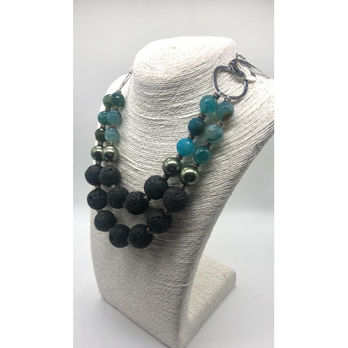 242 - A Sublime Volcanic Black Lava, Shell Pearl and Agate Necklace. Black lava - 20mm. High lustre shell ... 