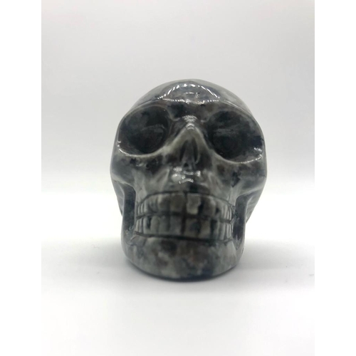 339 - A Hand Carved Spectrolite Crystal Skull Figure. An eclectic ornament or small paper weight. 5 x 4cm.