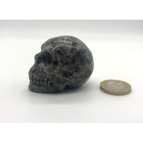 339 - A Hand Carved Spectrolite Crystal Skull Figure. An eclectic ornament or small paper weight. 5 x 4cm.