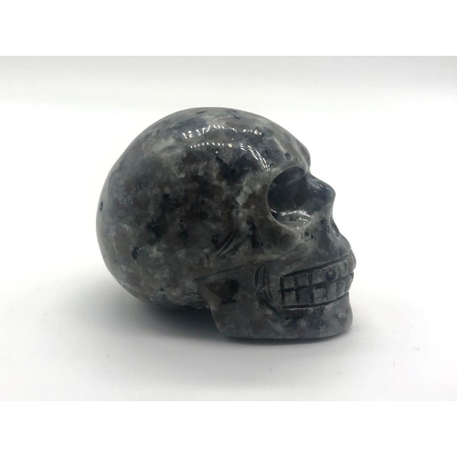 339 - A Hand Carved Spectrolite Crystal Skull Figure. An eclectic ornament or small paper weight. 5 x 4cm.