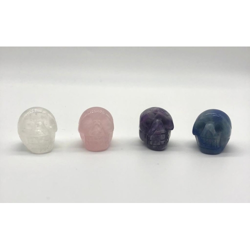 427 - Four Miniature Skull Figures. Clear and Rose Quartz. Lapis Lazuli and Amethyst. 2 x 2cm