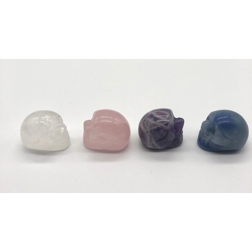 427 - Four Miniature Skull Figures. Clear and Rose Quartz. Lapis Lazuli and Amethyst. 2 x 2cm