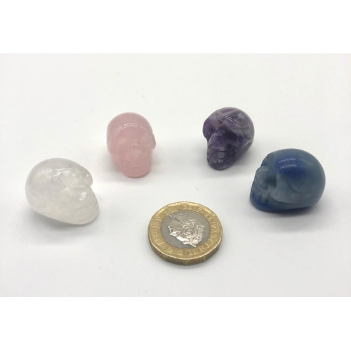 427 - Four Miniature Skull Figures. Clear and Rose Quartz. Lapis Lazuli and Amethyst. 2 x 2cm