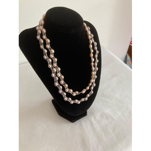 483 - SILVER and PEARL necklace having twin rows of Rosaline and lavender pearls mounted on silver and fas... 