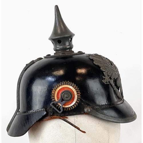 69 - WW1 Prussian M1915 Infantry Pickelhaube. Unit stamped. With liner & cockades.