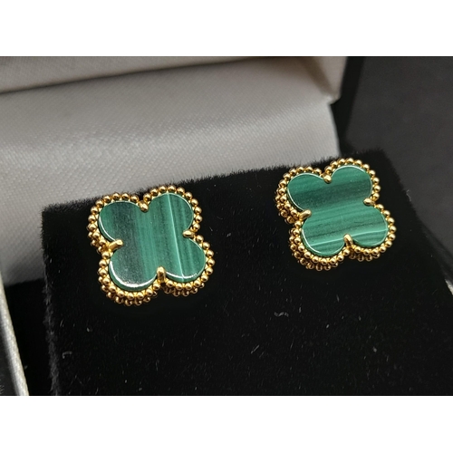 37 - A Pair of 18K Yellow Gold Van Cleef and Arpels Alhambra Malachite Earrings. 3.37g total weight.