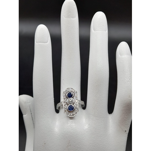 5 - A 950 Platinum Sapphire and Diamond W.G.I Certified Art Deco Ring. A platinum ring with 31 round bri... 