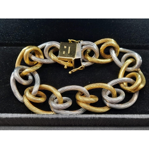 2 - A Very Unique 18K Yellow and White Gold W.G.I. Certified Bracelet. Barbed-wire effect links. 100.88g... 